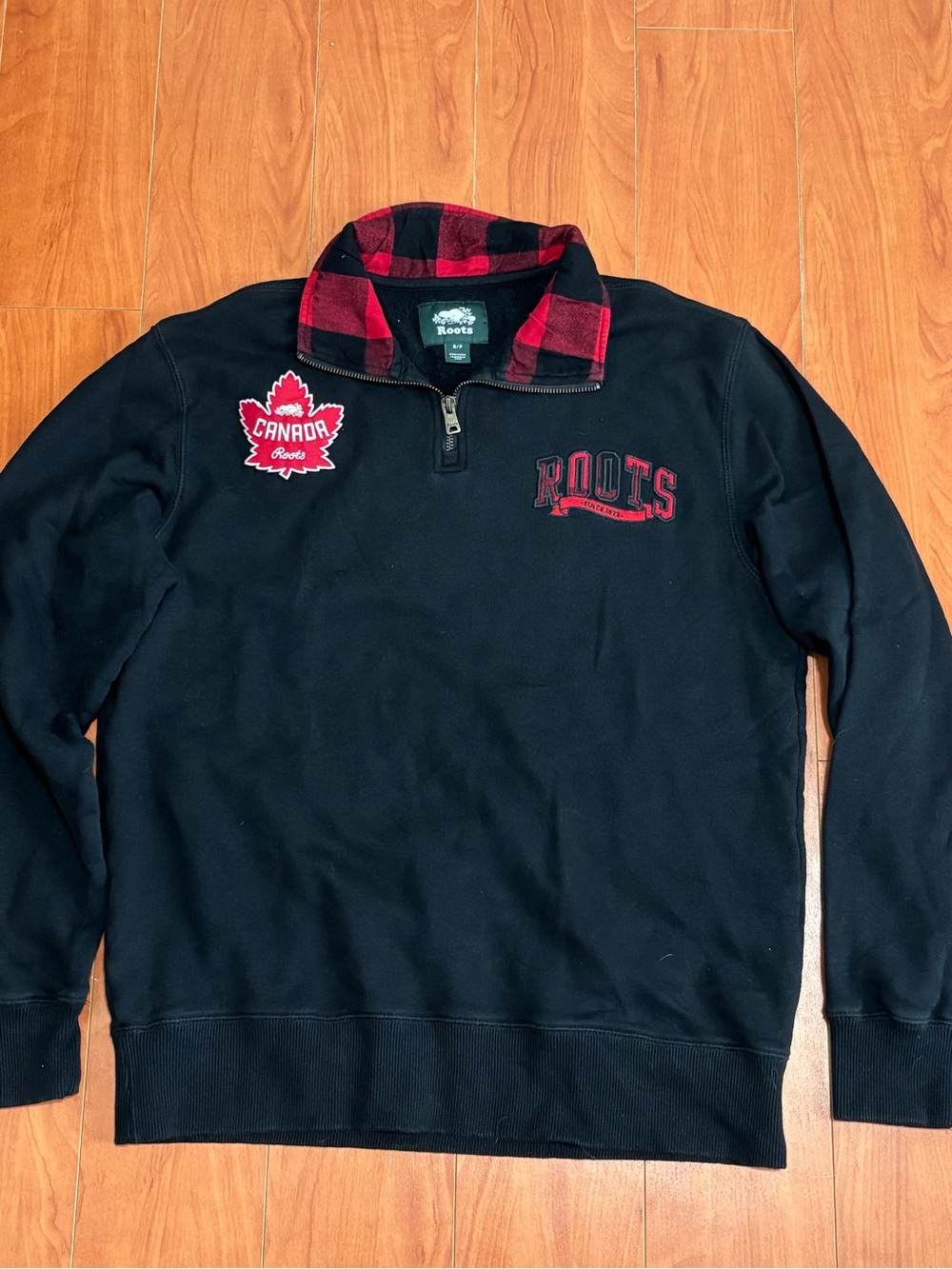 Roots Black Quarter-Zip Sweater with Red Plaid Collar